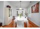 Dining room boasting hardwood floors, white table, and bright, natural light at 708 Copperline Dr # 101, Chapel Hill, NC 27516