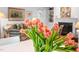 Close-up of fresh tulips in a dining room, showcasing a bright, airy interior at 708 Copperline Dr # 101, Chapel Hill, NC 27516