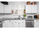 Bright kitchen with stainless steel appliances, granite counters, and white cabinetry at 708 Copperline Dr # 101, Chapel Hill, NC 27516