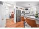 Open kitchen with stainless steel appliances, granite countertops, and sleek cabinetry at 708 Copperline Dr # 101, Chapel Hill, NC 27516