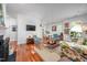 Bright living room with hardwood floors, white walls, stylish furnishings, and open dining area at 708 Copperline Dr # 101, Chapel Hill, NC 27516