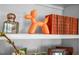 Stylish shelf showcasing decorative items and a collection of classic books at 708 Copperline Dr # 101, Chapel Hill, NC 27516