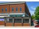 Modern brick Weaver Street Market with large windows and outdoor seating in a beautiful neighborhood at 708 Copperline Dr # 101, Chapel Hill, NC 27516