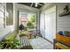 Bright sunroom with comfortable seating and view of neighborhood landscape at 708 Copperline Dr # 101, Chapel Hill, NC 27516