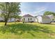 Spacious backyard with dining area, lounge area, and shed, perfect for outdoor entertaining and relaxation at 715 Barlang Cir, Fuquay Varina, NC 27526