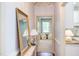 Bright hallway leads to an open floorplan and connects living spaces with hardwood flooring at 715 Barlang Cir, Fuquay Varina, NC 27526