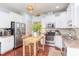 Well-lit eat-in kitchen featuring stainless appliances, a breakfast bar, and ample cabinet space at 715 Barlang Cir, Fuquay Varina, NC 27526