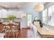 Eat-in kitchen features stainless appliances, island with seating, and access to the outdoor patio at 715 Barlang Cir, Fuquay Varina, NC 27526
