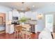 Charming kitchen with stainless appliances, stone countertops, and modern lighting at 715 Barlang Cir, Fuquay Varina, NC 27526