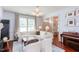 Bright and airy living room featuring hardwood floors, modern lighting, and stylish decor at 715 Barlang Cir, Fuquay Varina, NC 27526