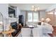 Inviting living room with a fireplace, comfortable seating, hardwood floors, and stylish decor at 715 Barlang Cir, Fuquay Varina, NC 27526