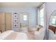 Light-filled main bedroom with ensuite bathroom and dual windows at 715 Barlang Cir, Fuquay Varina, NC 27526