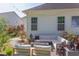 Outdoor patio with string lights, sectional seating, and fire pit at 715 Barlang Cir, Fuquay Varina, NC 27526