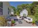 Cozy backyard patio area with comfortable seating, a fire pit, and a white shed, perfect for outdoor relaxation at 715 Barlang Cir, Fuquay Varina, NC 27526