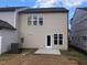 Backyard featuring a lawn with newly laid sod and a concrete patio at 718 Colby Pl, Durham, NC 27713