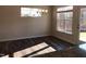 Inviting dining area featuring wood floors, modern chandelier, and sunlit windows overlooking backyard at 718 Colby Pl, Durham, NC 27713