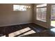 Inviting dining area featuring wood floors, modern chandelier, and sunlit windows overlooking backyard at 718 Colby Pl, Durham, NC 27713