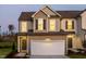 Charming two-story home featuring a attached garage and inviting curb appeal at 718 Colby Pl, Durham, NC 27713