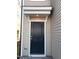 Stylish front door with a covered entryway for added protection at 718 Colby Pl, Durham, NC 27713