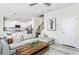 Comfortable living room with modern sectional, wood coffee table, and open to kitchen at 718 Colby Pl, Durham, NC 27713