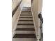 New staircase with wood treads and white risers leads to upper level of new construction home at 718 Colby Pl, Durham, NC 27713
