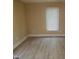 Neutral bedroom with two windows providing natural light at 725 Van Thomas Dr, Raleigh, NC 27615