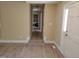Hallway leading to the laundry area with views of the front door at 725 Van Thomas Dr, Raleigh, NC 27615