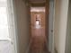 Hallway leading to the kitchen area and additional rooms at 725 Van Thomas Dr, Raleigh, NC 27615