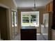 Kitchen featuring an island, stainless steel appliances, and a large window at 725 Van Thomas Dr, Raleigh, NC 27615