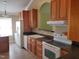Traditional kitchen featuring wooden cabinetry, white appliances, and ample counter space at 725 Van Thomas Dr, Raleigh, NC 27615