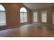 Bright living room featuring vaulted ceilings, hardwood floors, and large windows at 725 Van Thomas Dr, Raleigh, NC 27615