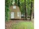 View of shed in the backyard surrounded by lush trees at 725 Van Thomas Dr, Raleigh, NC 27615