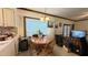 Cozy dining area adjacent to the kitchen, with a round table and a window at 7312 Ray Rd, Raleigh, NC 27613