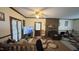Inviting living room features a brick fireplace, plush seating, and a ceiling fan for comfortable gatherings at 7312 Ray Rd, Raleigh, NC 27613