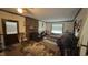 Cozy living room with a brick fireplace, neutral walls, and comfortable seating arrangement at 7312 Ray Rd, Raleigh, NC 27613