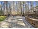 Backyard features natural stone outdoor living area and fire pit at 7420 Heartland Dr, Wake Forest, NC 27587