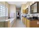 Bathroom with double sinks, bathtub, walk-in shower, and natural light at 7420 Heartland Dr, Wake Forest, NC 27587