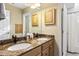 Bathroom features a double sink vanity with granite countertop and wood cabinets at 7420 Heartland Dr, Wake Forest, NC 27587