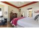 Bedroom with wood floors, bright windows, and stylish decor at 7420 Heartland Dr, Wake Forest, NC 27587