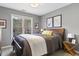 Bedroom with a large window, grey walls, and soft carpet at 7420 Heartland Dr, Wake Forest, NC 27587