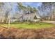 Charming home exterior with lush greenery and a well-kept lawn at 7420 Heartland Dr, Wake Forest, NC 27587