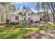 Spacious property with manicured lawn and mature trees surrounding the elegant home at 7420 Heartland Dr, Wake Forest, NC 27587