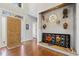 Entryway featuring hardwood floors, a custom shelf, and artistic wall decor at 7420 Heartland Dr, Wake Forest, NC 27587