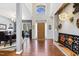 Bright foyer with hardwood floors, high ceilings, and view to dining room at 7420 Heartland Dr, Wake Forest, NC 27587