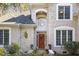 Close-up of the elegant front door with a decorative wreath and transom window at 7420 Heartland Dr, Wake Forest, NC 27587