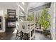 Bright kitchen featuring a stone fireplace, eat-in island, and large windows bringing the outdoors in at 7420 Heartland Dr, Wake Forest, NC 27587