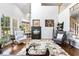 Cozy living room with a fireplace, comfortable seating, and lots of natural light at 7420 Heartland Dr, Wake Forest, NC 27587