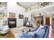 Open living room with a fireplace, staircase, and modern decor at 7420 Heartland Dr, Wake Forest, NC 27587