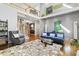 Spacious living room with high ceilings, comfortable seating, and modern art at 7420 Heartland Dr, Wake Forest, NC 27587