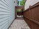 Private backyard patio area with a pergola and swing for relaxation at 7829 Acc Blvd, Raleigh, NC 27617